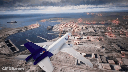 A Fedex Plane Is Flying Over A City With A Large Body Of Water In The Background GIF