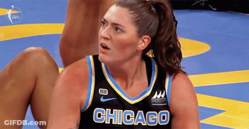 A Female Basketball Player From Chicago Is Sitting On The Floor GIF