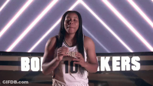 A Female Basketball Player In Front Of A Sign That Says Kers GIF
