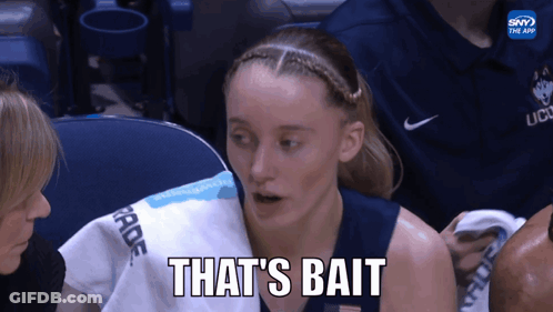 A Female Basketball Player Says " That 'S Bait " While Holding A Towel Over Her Shoulder GIF