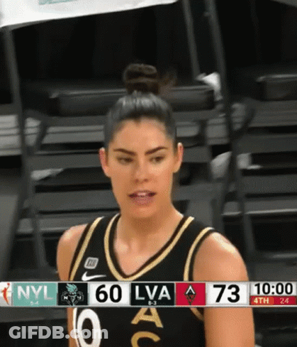 A Female Basketball Player Stands In Front Of A Scoreboard With Nyl 60 Lva 73 GIF