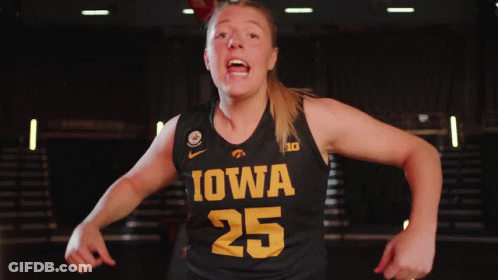 A Female Basketball Player Wearing A Black Jersey With Iowa 25 On It GIF