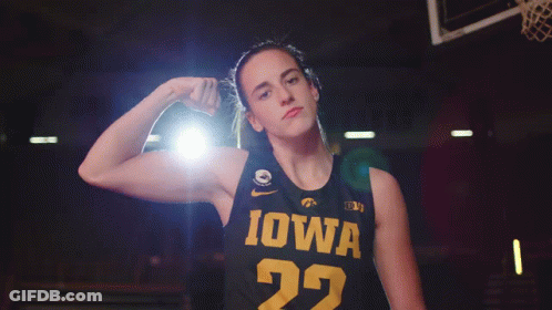 A Female Basketball Player Wearing A Black Jersey With Iowa On It GIF