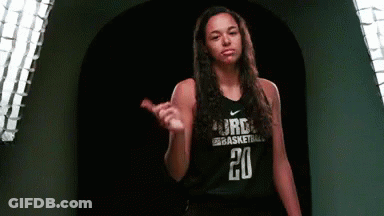 A Female Basketball Player Wearing A Black Jersey With The Number 20 On It GIF