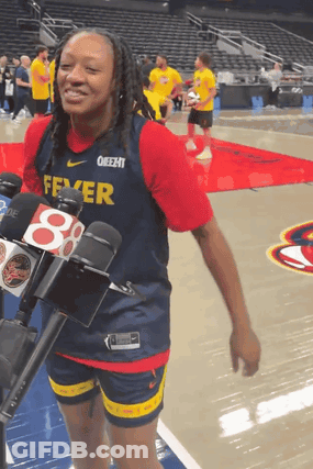 A Female Basketball Player Wearing A Fever Jersey GIF