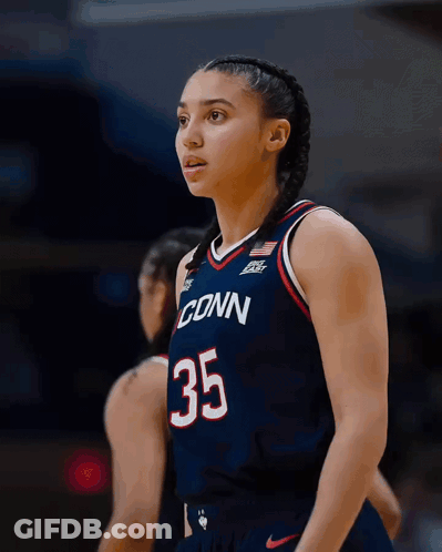A Female Basketball Player Wearing A Jersey That Says Conn 35 GIF