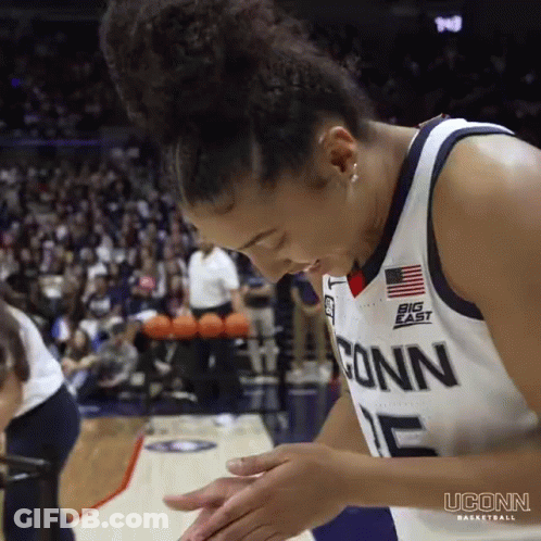 A Female Basketball Player Wearing A Jersey That Says Conn On It GIF