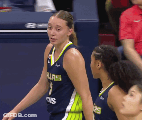 A Female Basketball Player Wearing A Jersey That Says Ovs On The Front GIF