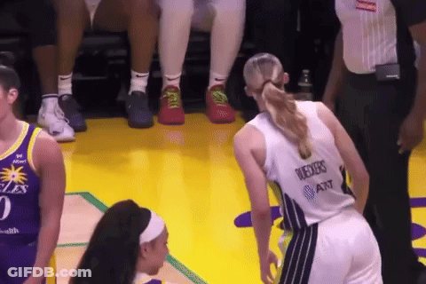 A Female Basketball Player Wearing A Jersey That Says ' Reeves At & T ' On The Back GIF