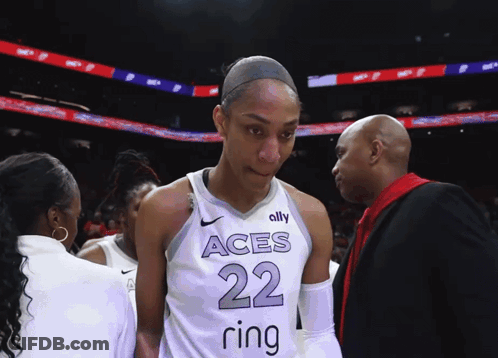 A Female Basketball Player Wearing A Jersey With The Number 22 On It GIF