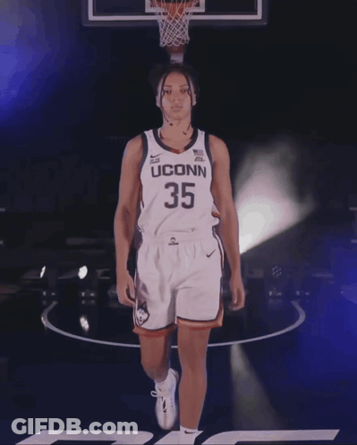 A Female Basketball Player Wearing A Jersey With The Number 33 On It GIF