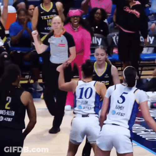 A Female Basketball Player Wearing A Number 10 Jersey GIF
