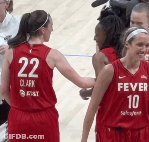 A Female Basketball Player Wearing A Red Jersey With The Number 22 On The Back GIF