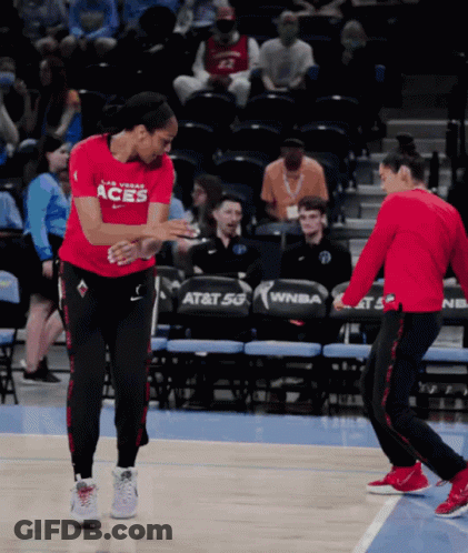 A Female Basketball Player Wearing A Red Shirt That Says Las Vegas Aces GIF