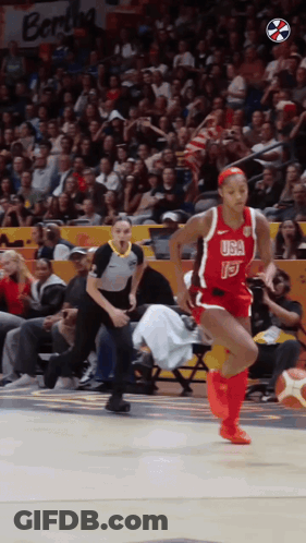 A Female Basketball Player Wearing A Red Usa Jersey GIF