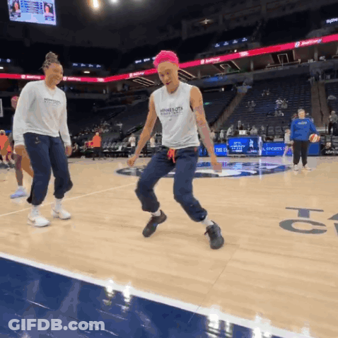 A Female Basketball Player Wearing A Tank Top With The Word Warriors On The Front GIF