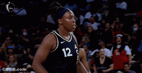 A Female Basketball Player With The Number 12 On Her Shirt GIF