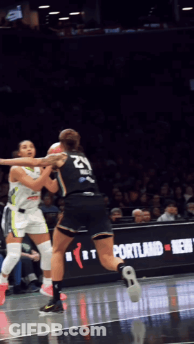A Female Basketball Player With The Number 21 On Her Back GIF