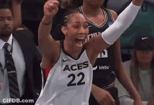 A Female Basketball Player With The Number 22 On Her Jersey Is Celebrating GIF