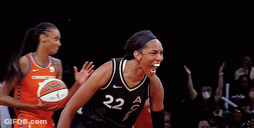 A Female Basketball Player With The Number 22 On Her Jersey Is Celebrating GIF