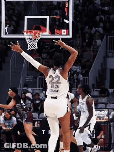 A Female Basketball Player With The Number 22 On The Back Of Her Jersey GIF