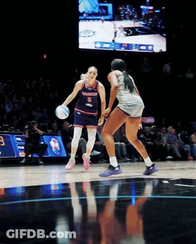 A Female Basketball Player With The Number 8 On Her Shirt GIF