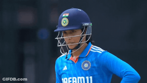 A Female Cricket Player Wearing A Blue Shirt That Says Dream 11 GIF