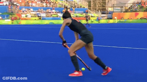 A Female Field Hockey Player With The Number 9 On Her Shorts GIF