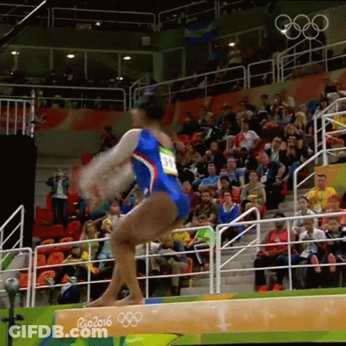 A Female Gymnast Performs On A Balance Beam Sponsored By Rio 2016 GIF