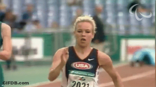 A Female Runner Wearing A Usa Shirt Is Running GIF