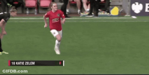 A Female Soccer Player Named Katie Zelen Is Running On A Field GIF