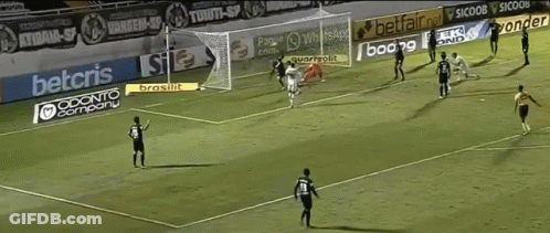 A Female Soccer Player Takes Off Her Shirt In Front Of A Vito Sign GIF