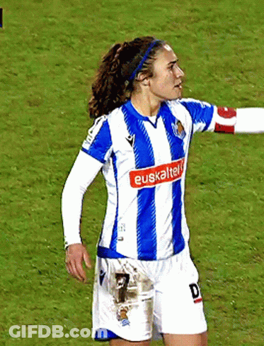 A Female Soccer Player Wearing A Blue And White Jersey That Says Euskaltel On The Front GIF