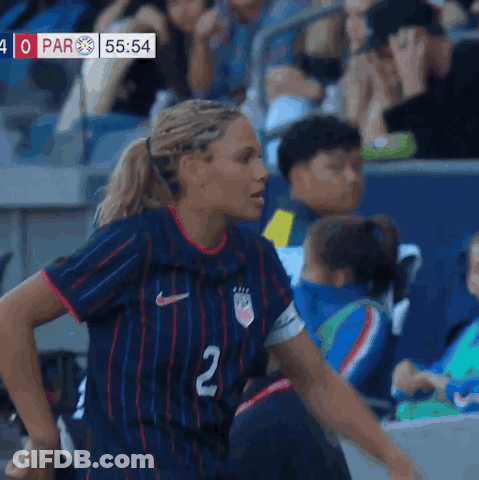 A Female Soccer Player Wearing A Blue Jersey With The Number 2 On It GIF