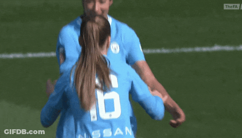 A Female Soccer Player Wearing A Number 6 Jersey Is Hugging Another Player GIF