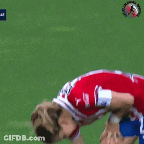 A Female Soccer Player Wearing A Red And White Striped Jersey With Coca Cola On The Sleeves GIF