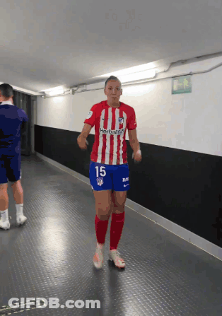 A Female Soccer Player Wearing A Red White And Blue Jersey With The Number 15 On The Shorts GIF