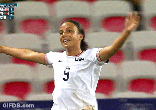 A Female Soccer Player Wearing A White Usa Jersey GIF