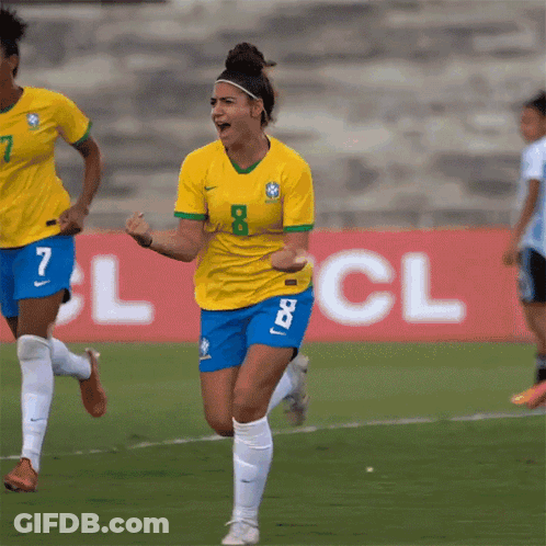 A Female Soccer Player Wearing A Yellow Shirt With The Number 8 On It GIF