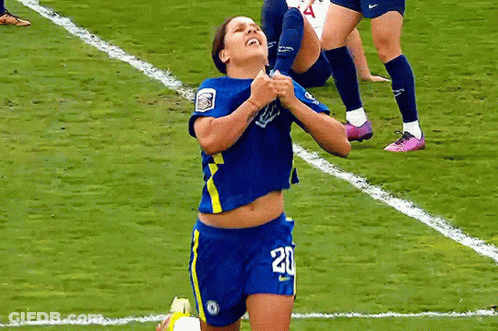 A Female Soccer Player Wearing Number 20 Is Kneeling On The Field GIF