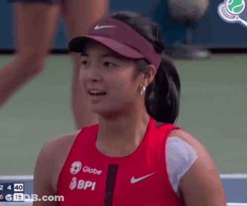 A Female Tennis Player Wearing A Globe Bpi Shirt GIF