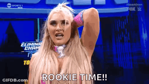 A Female Wrestler Is Holding Her Hand To Her Head And Saying Rookie Time . GIF