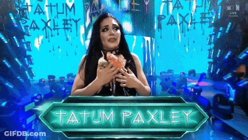 A Female Wrestler Named Tatum Paxley Holds A Cupcake GIF