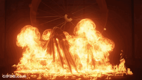 A Ferris Wheel Is Surrounded By A Large Amount Of Flames GIF