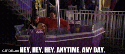 A Ferris Wheel With A Sign That Says Push Here GIF