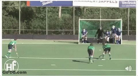 A Field Hockey Game Is Being Played In Front Of A Banner That Says Verbun Student GIF