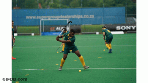 A Field Hockey Game Is Being Played In Front Of A Sony Ad GIF