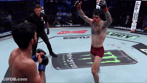 A Fighter In A Boxing Ring With A Monster Energy Can In The Background GIF