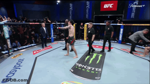 A Fighter In A Ufc Ring With A Monster Energy Can On The Ground GIF