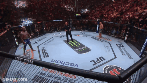 A Fighter In A Ufc Ring With A Monster Energy Drink On The Floor GIF